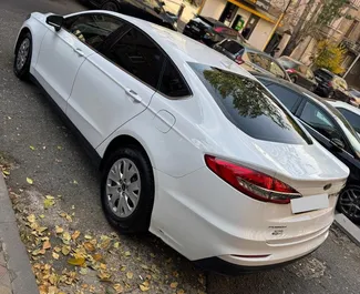 在 在亚美尼亚 租赁 Ford Fusion Sedan 2020 汽车，特点包括 ✓ 使用 Petrol 燃料和 185 马力 ➤ 起价 70 USD 每天。